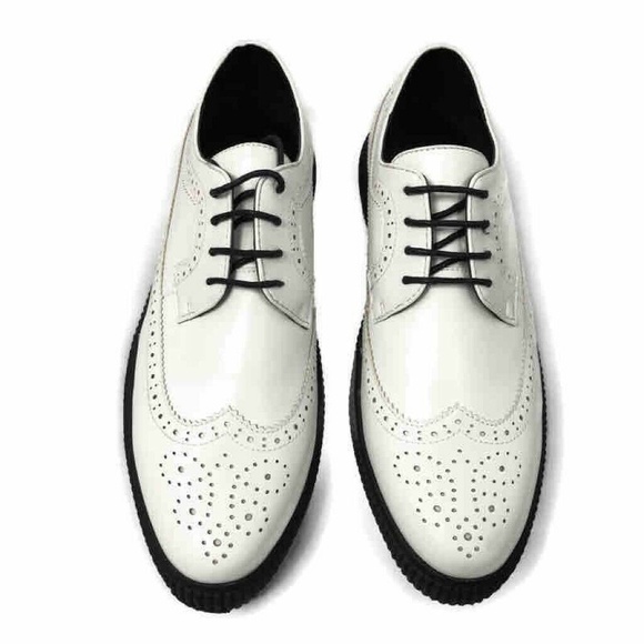 white wingtip shoes